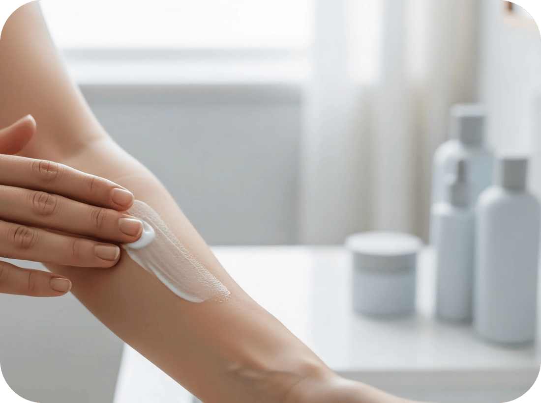 Applying cream to a womans inside forearm Square-modified