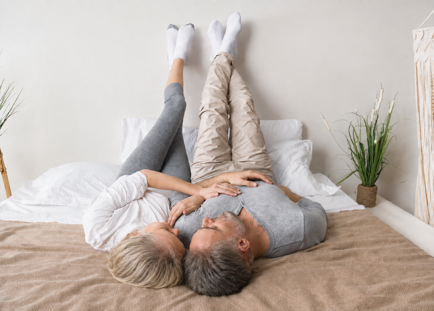 Couple with feet on wall